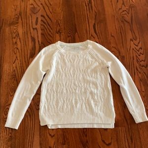 I am selling a white long sleeve sweater.